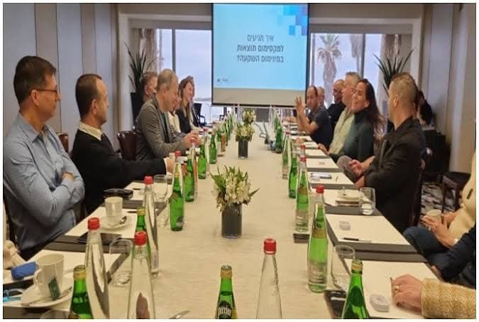 Business seminar around a boardroom table