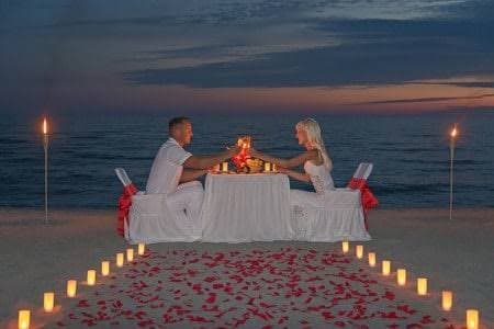 Candlelit private beach dinner at sunset