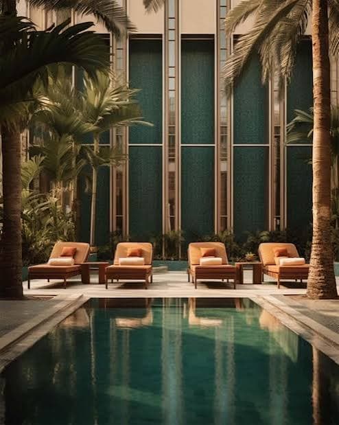 Palm-lined luxury hotel courtyard pool