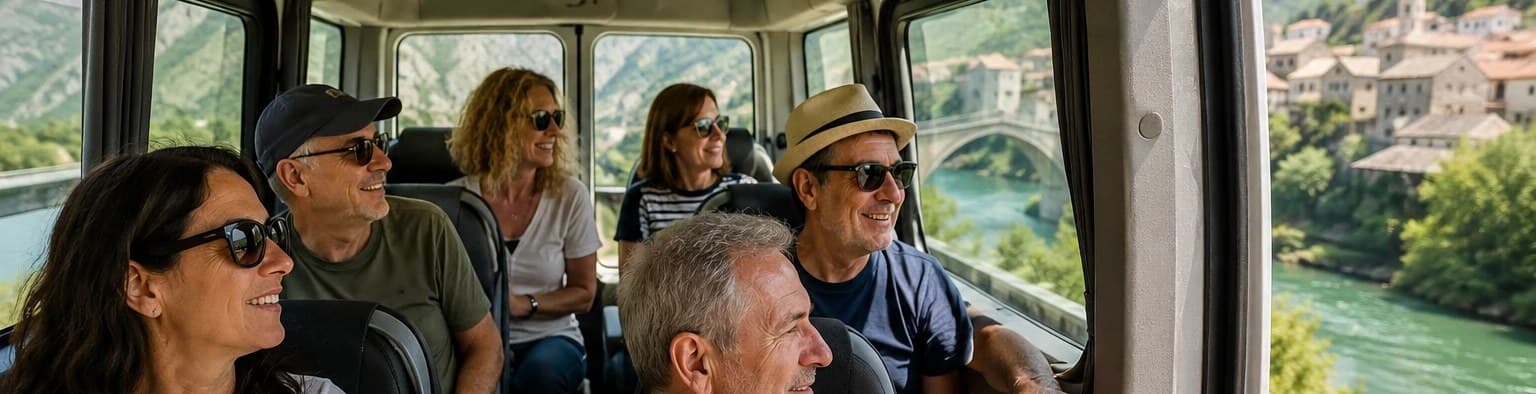 Small private group of travelers in a minibus with a Balkan river town view